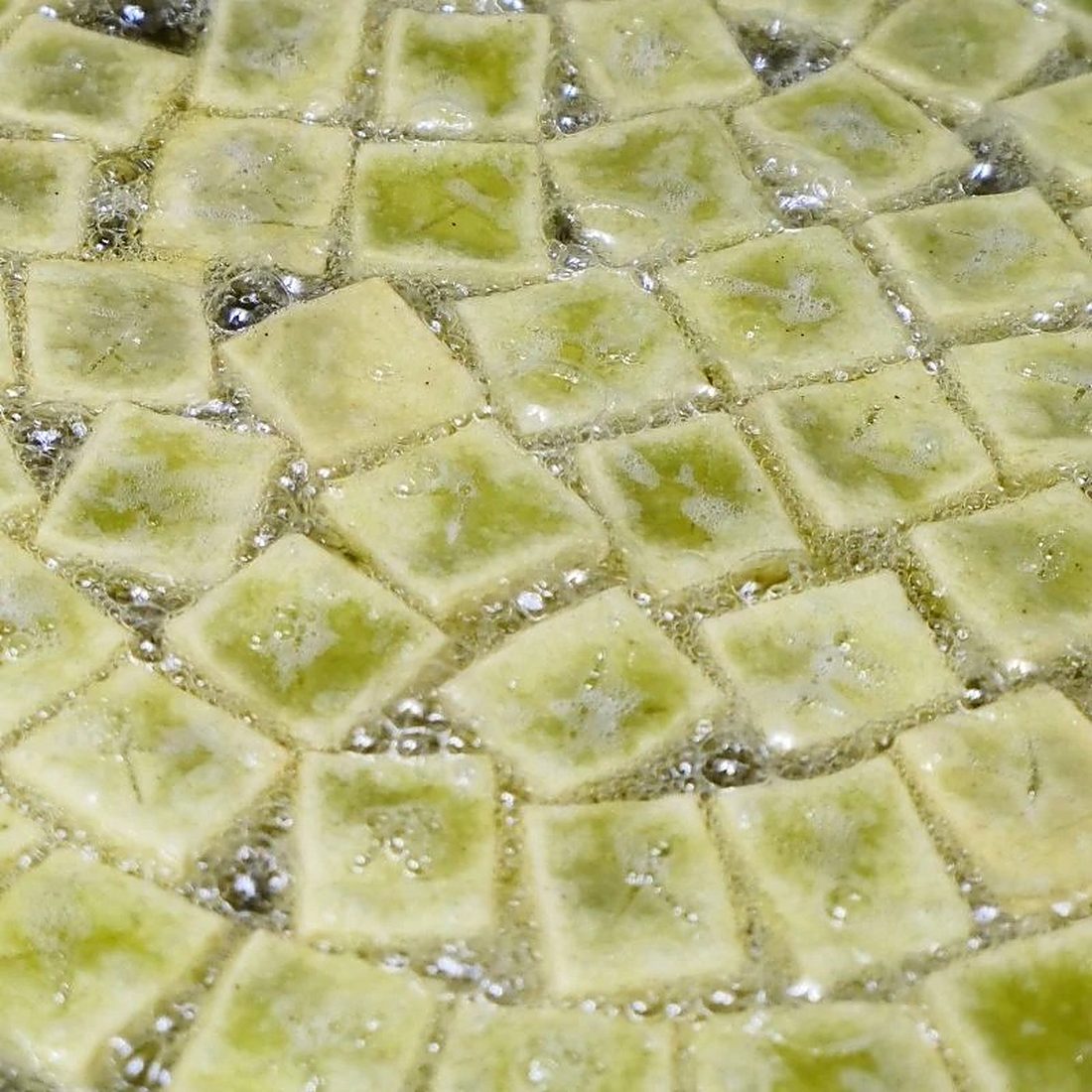 Green tea yakgwa laid out in a grid